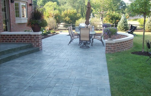https://www.budsconcreteinc.com/wp-content/uploads/2016/03/Ashlar-Slate-Concrete-Patio-and-Brick-Seating-Wall-2-500x320.jpg