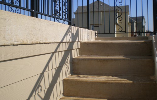 https://www.budsconcreteinc.com/wp-content/uploads/2016/03/Concrete-Steps-Leading-to-Raised-Concrete-Deck-500x320.jpg