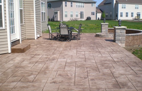 https://www.budsconcreteinc.com/wp-content/uploads/2016/03/Majestic-Ashlar-Patio-with-Unilock-Columns-Seat-Wall-and-Firepit-500x320.jpg