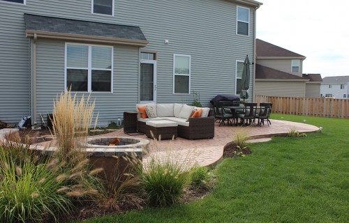 https://www.budsconcreteinc.com/wp-content/uploads/2016/03/Mayan-Cobblestone-Patio-with-Unilock-Firepit-and-Seat-Wall-2-500x320.jpg