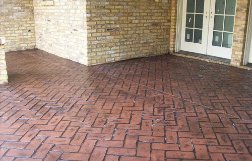 https://www.budsconcreteinc.com/wp-content/uploads/2016/03/Old-Chicago-Herringbone-Stamped-Concrete-Porch-500x320.jpg